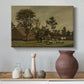Canvas art print featuring a rural landscape featuring farm building and natural setting, styled above a decorative console