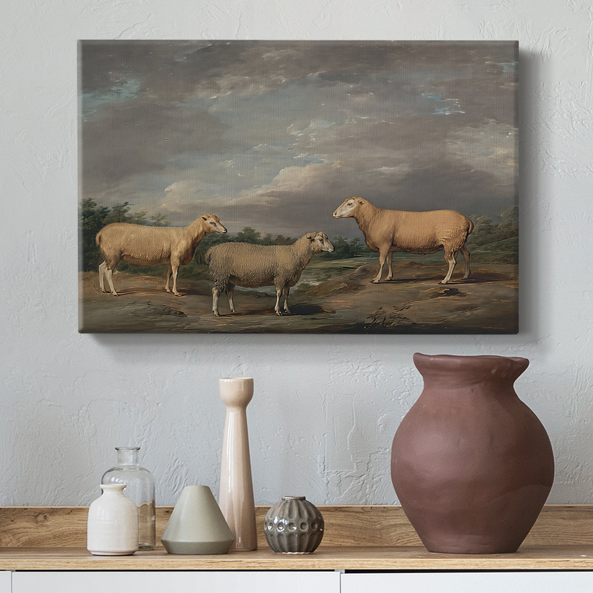 Canvas art print featuring a pastoral scene with sheep arranged in rural field, styled above a decorative console