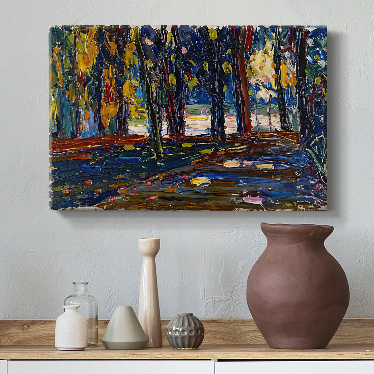 Canvas art print featuring a semi-abstract composition with trees and layered brushwork, styled above a decorative console