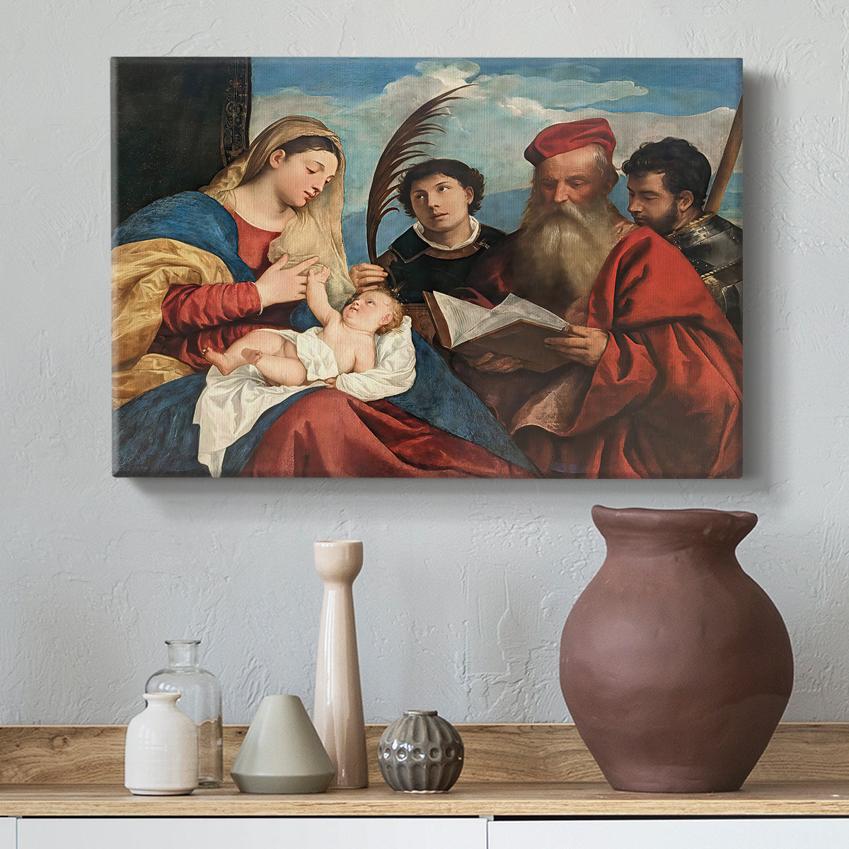 Canvas art print featuring a Renaissance group portrait of sacred figures in close arrangement, styled above a decorative console