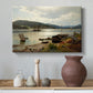 Canvas art print featuring a coastal landscape with figures engaged in daily activity, styled above a decorative console
