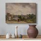 Canvas art print featuring a countryside scene with cottage, styled above a decorative console