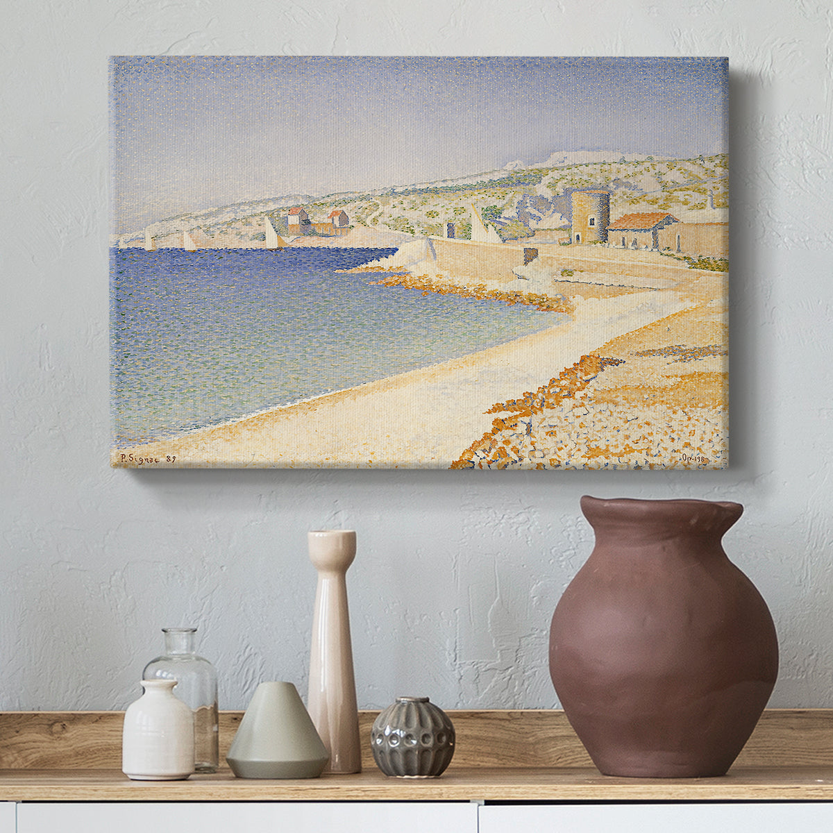 Canvas art print featuring a pointillist coastal composition, styled above a decorative console