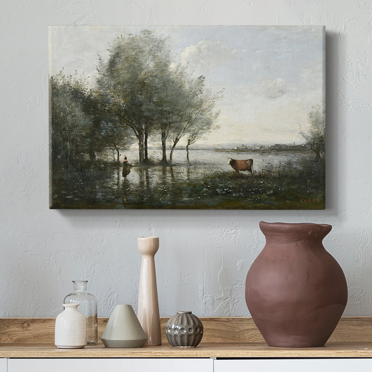 Canvas art print featuring a muted landscape with waterlogged terrain and trees, styled above a decorative console