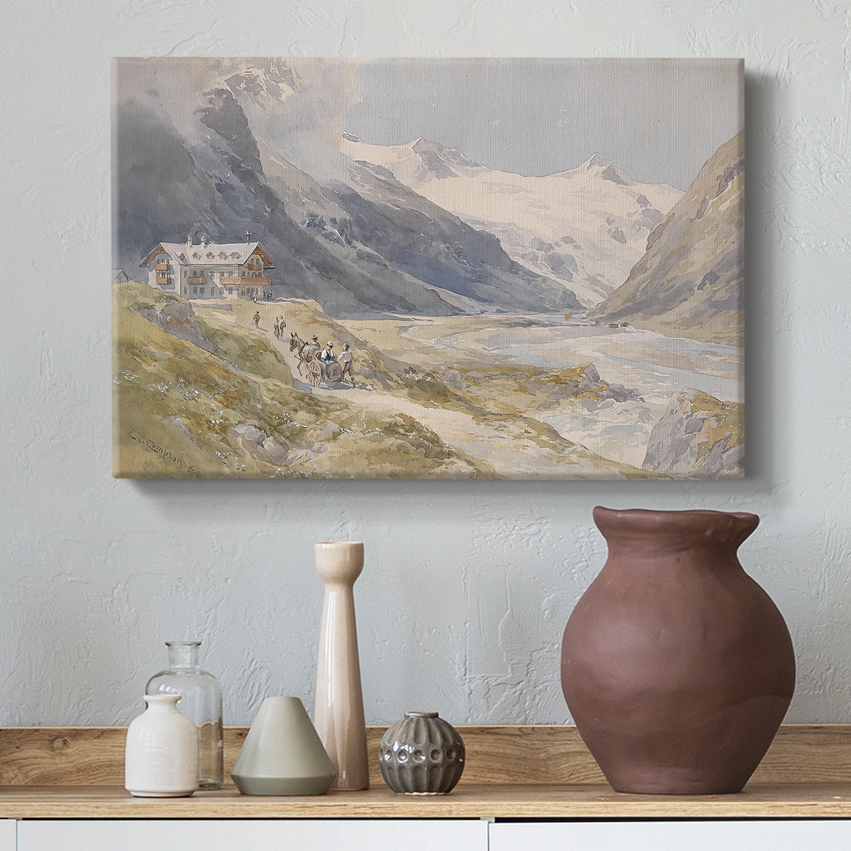 Canvas art print featuring a rural alpine setting with shepherds and open terrain, styled above a decorative console