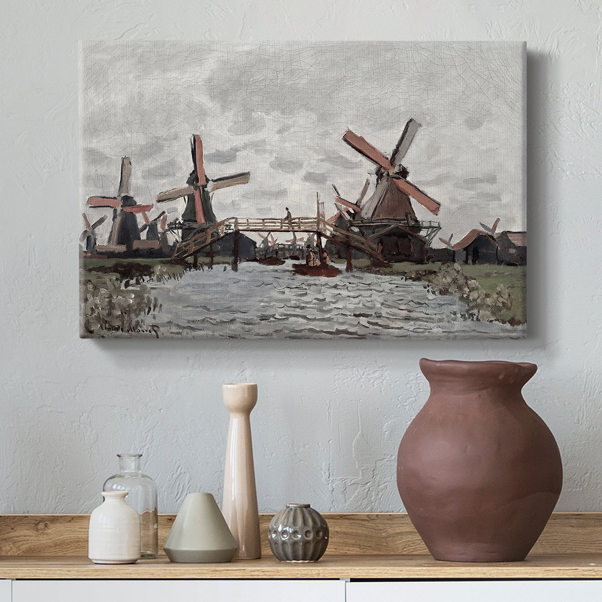 Canvas art print featuring a countryside scene with traditional windmills and reflections, styled above a decorative console