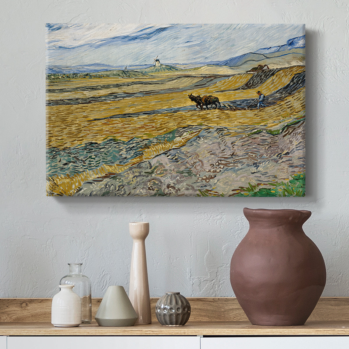 Canvas art print featuring a post-impressionist farm scene with cultivated land and open horizon, styled above a decorative console