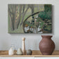 Canvas art print featuring an expressive nature scene with stream, styled above a decorative console