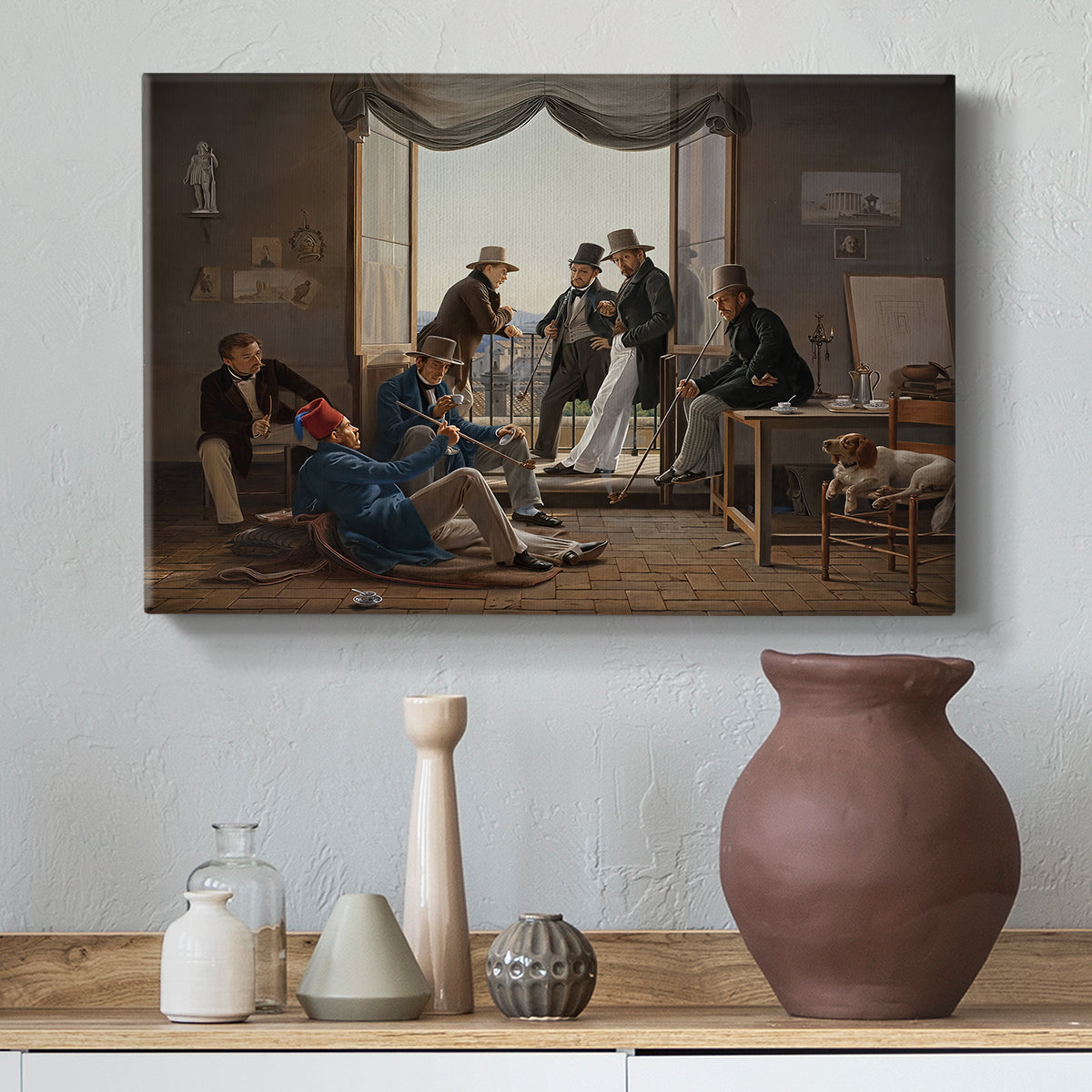 Canvas art print featuring a portrait of artists seated and standing together in interior spac, styled above a decorative console
