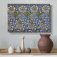 Canvas art print featuring an ornamental pattern combining birds, leaves, and flowers, styled above a decorative console