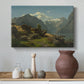 Canvas art print featuring a coastal landscape with calm water and mountainous backdrop, styled above a decorative console