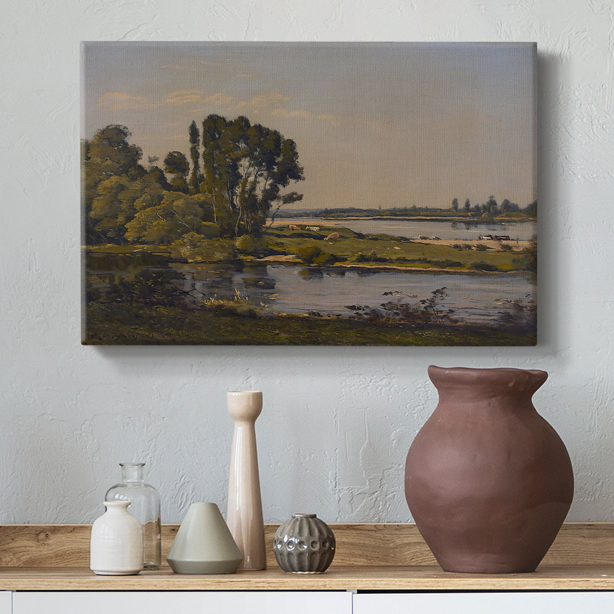Canvas art print featuring a tranquil natural setting with river and distant horizon, styled above a decorative console