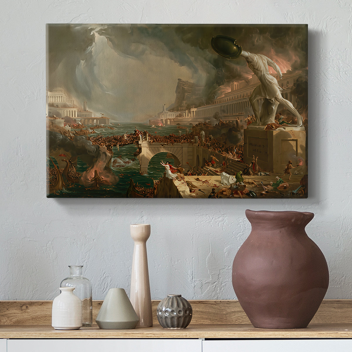 Canvas art print featuring an urban landscape in turmoil with figures fleeing and fighting, styled above a decorative console
