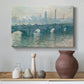 Canvas art print featuring a soft-toned river scene with bridge and muted skyline, styled above a decorative console
