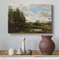 Canvas art print featuring a soft landscape with figures and foliage near shoreline, styled above a decorative console