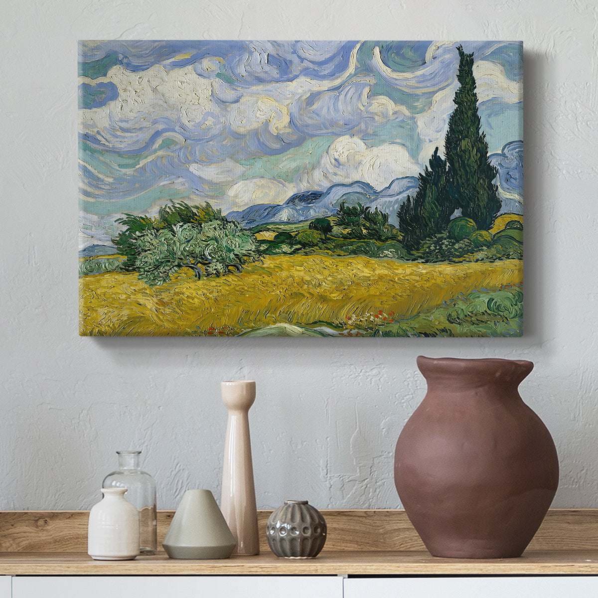 Canvas art print featuring a post-impressionist countryside scene with crops and sky, styled above a decorative console