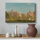 Canvas art print featuring a cityscape featuring ancient buildings and open terrain, styled above a decorative console
