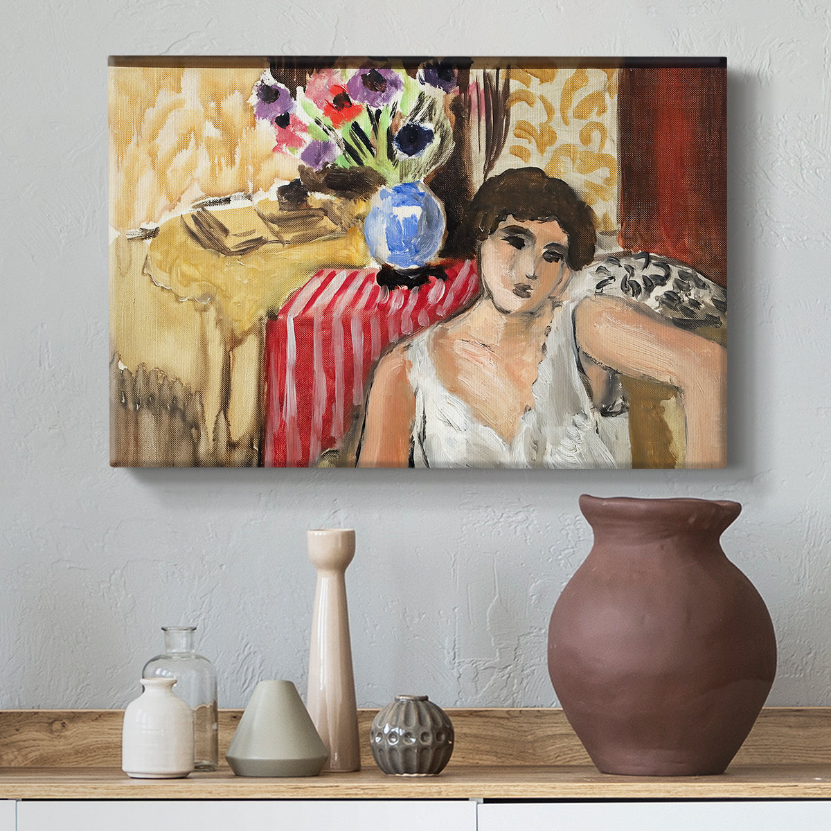 Canvas art print featuring an expressive seated figure with furnishings, styled above a decorative console