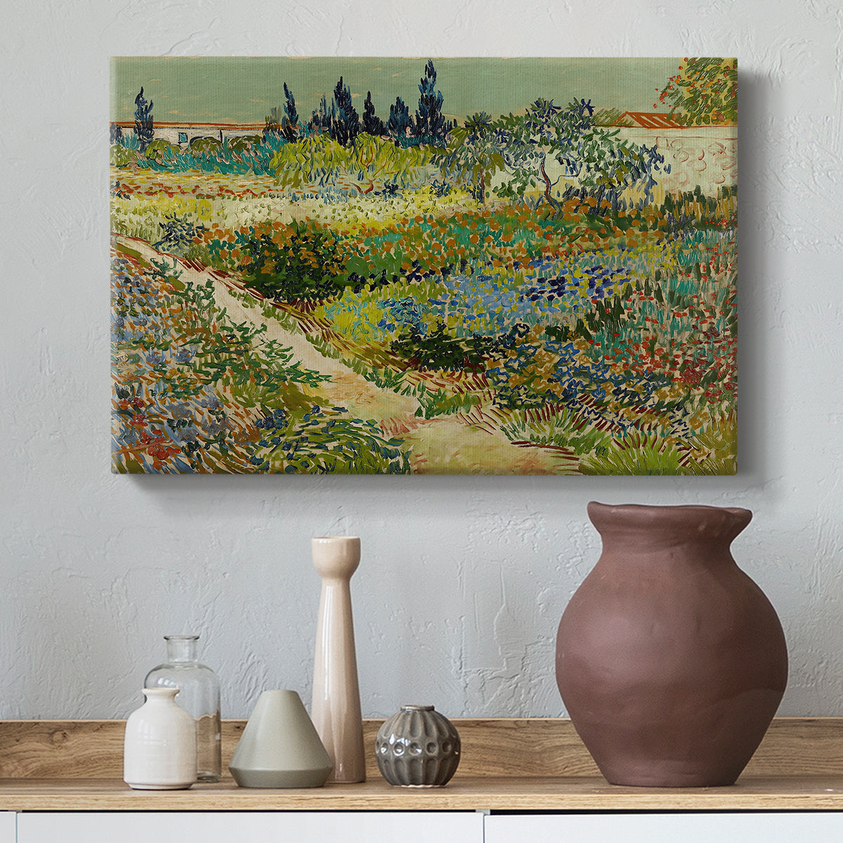 Canvas art print featuring a post-impressionist garden composition with layered greenery, styled above a decorative console
