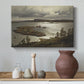 Canvas art print featuring an expansive waterway bordered by hills and sky, styled above a decorative console