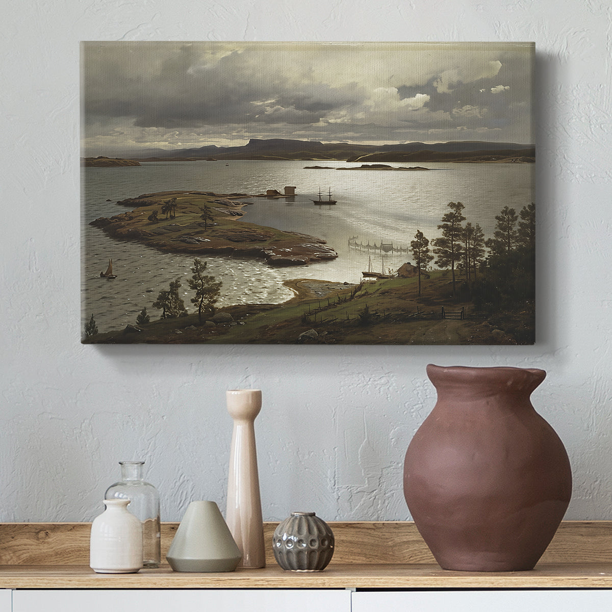 Canvas art print featuring an expansive waterway bordered by hills and sky, styled above a decorative console