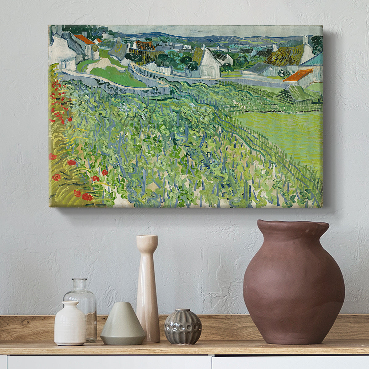 Canvas art print featuring a post-impressionist countryside composition with crops, styled above a decorative console