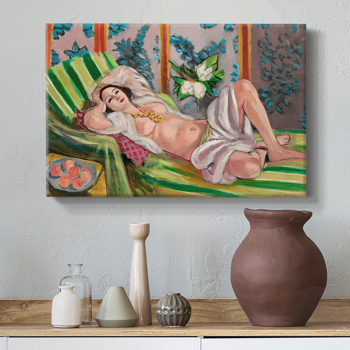Canvas art print featuring an expressive reclining figure amid floral motifs, styled above a decorative console
