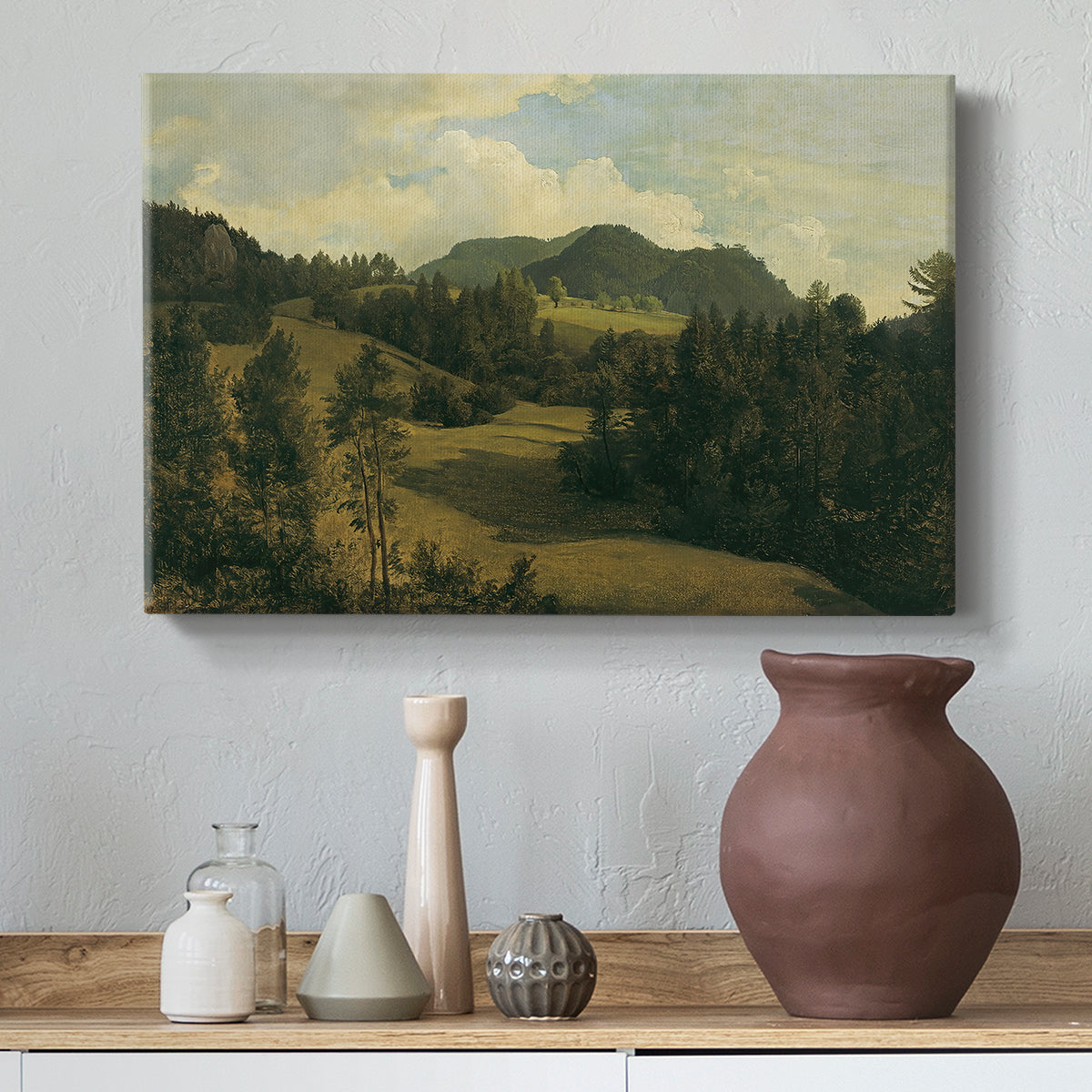 Canvas art print featuring a realistic landscape with depth, styled above a decorative console