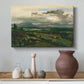 Canvas art print featuring an atmospheric landscape with architecture and elevation, styled above a decorative console