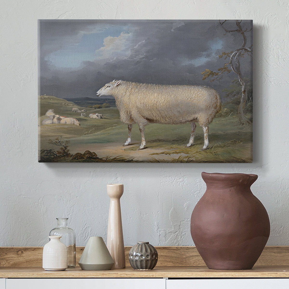 Canvas art print featuring a realistic depiction of sheep in countryside setting, styled above a decorative console
