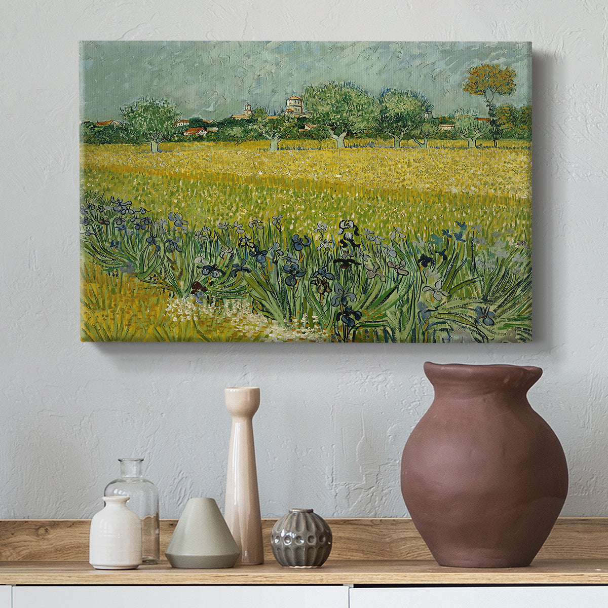 Canvas art print featuring a post-impressionist countryside scene with flowers and terrain, styled above a decorative console