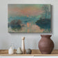 Canvas art print featuring an impressionist view of river at sunset with snowy banks, styled above a decorative console