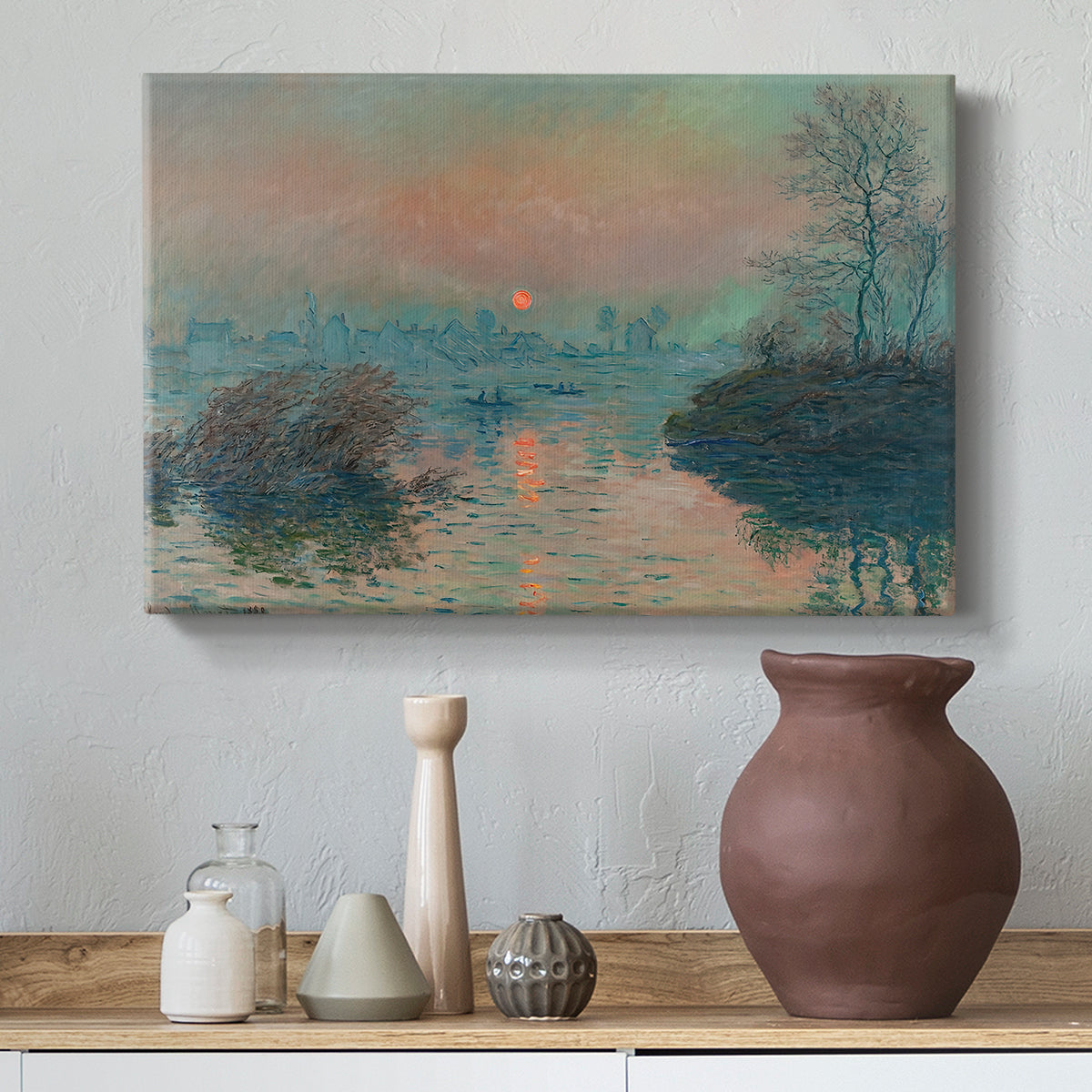 Canvas art print featuring an impressionist view of river at sunset with snowy banks, styled above a decorative console