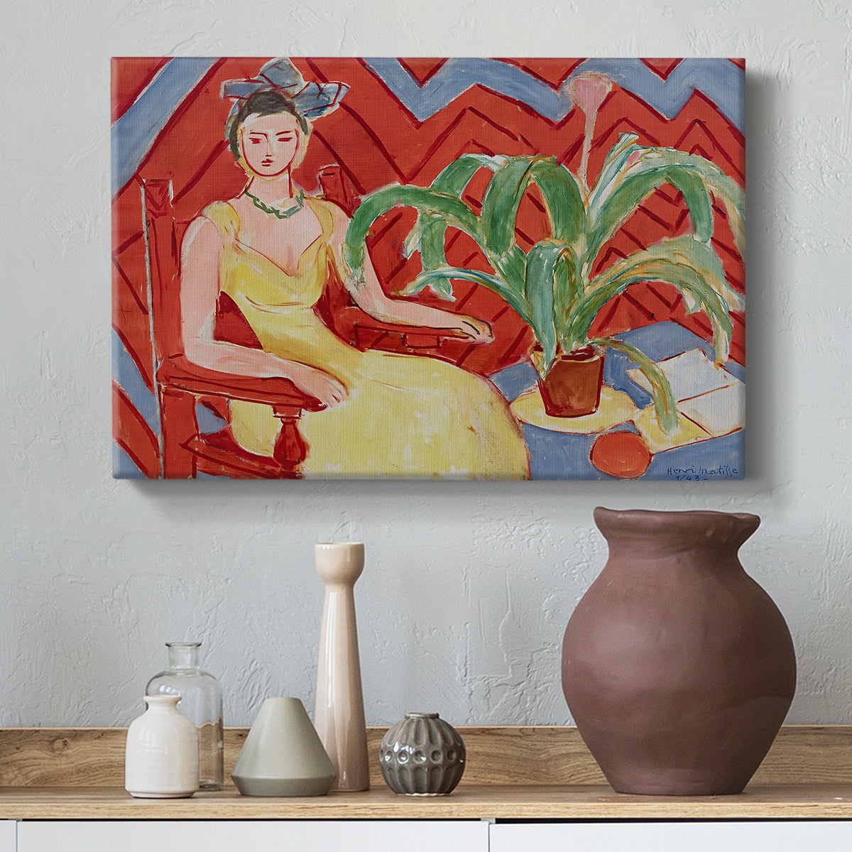 Canvas art print featuring a stylized seated female figure in strong warm tones, styled above a decorative console
