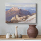Canvas art print featuring a high vantage point overlooking rugged mountain terrain, styled above a decorative console