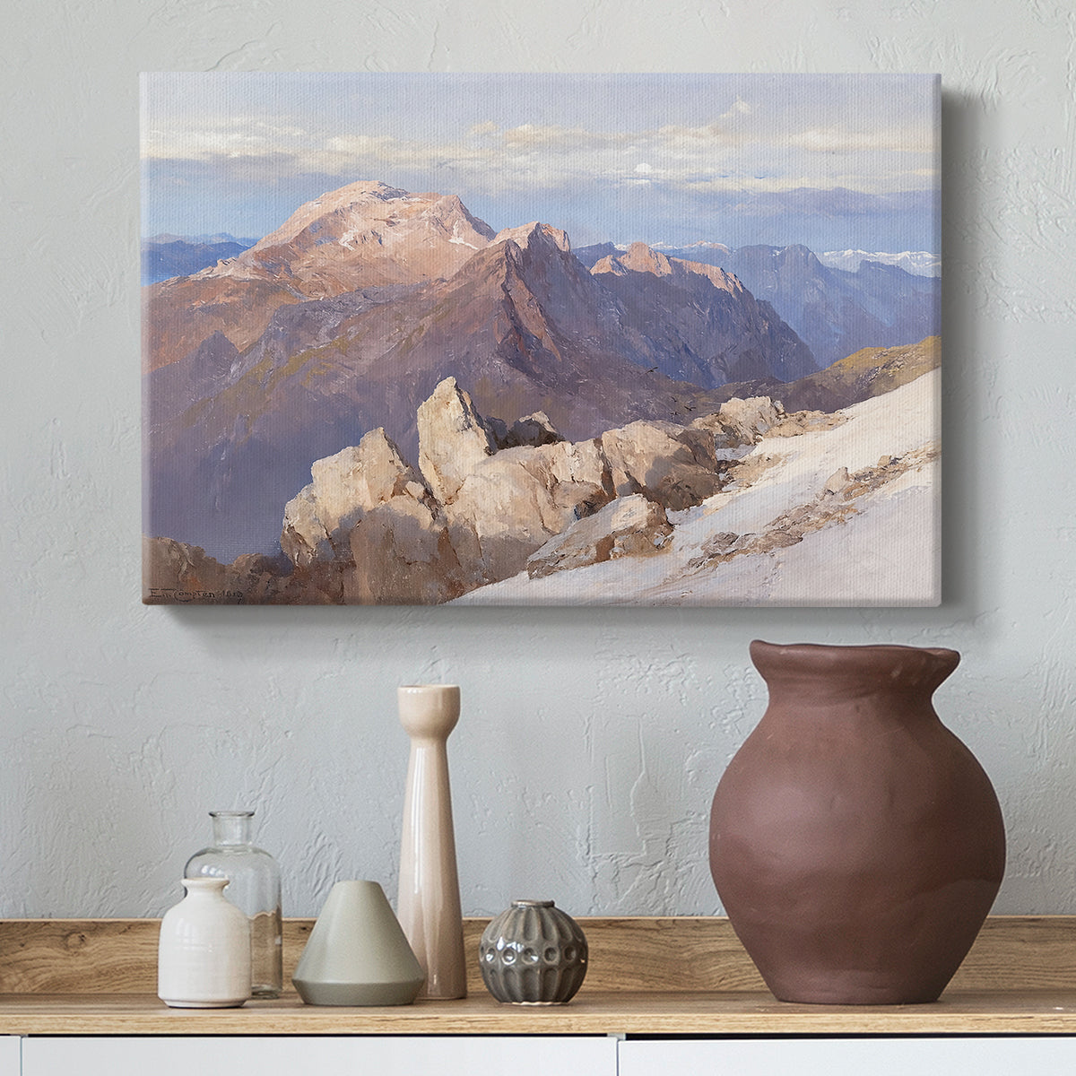 Canvas art print featuring a high vantage point overlooking rugged mountain terrain, styled above a decorative console