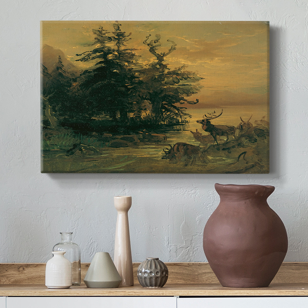 Canvas art print featuring an alpine landscape with deer, styled above a decorative console