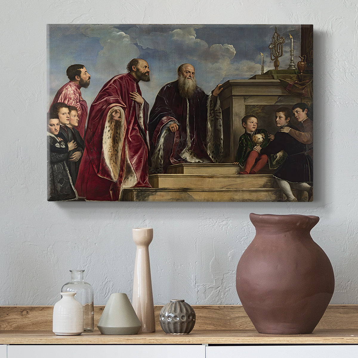 Canvas art print featuring a Renaissance family composition centered on ritual veneration, styled above a decorative console