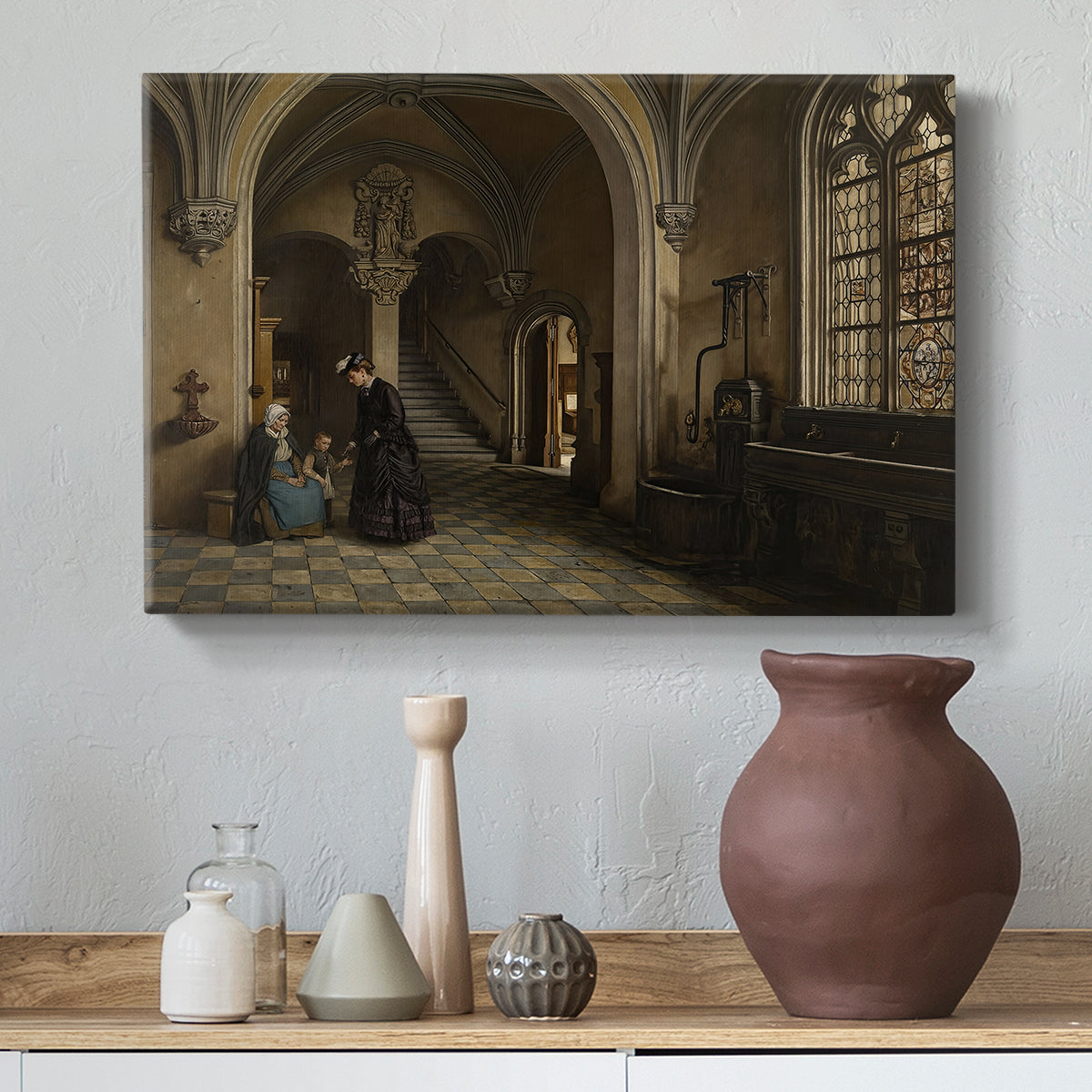 Canvas art print featuring a composition showing scale of church with people below, styled above a decorative console