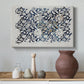Canvas art print featuring a decorative composition featuring branching stems and leaves, styled above a decorative console
