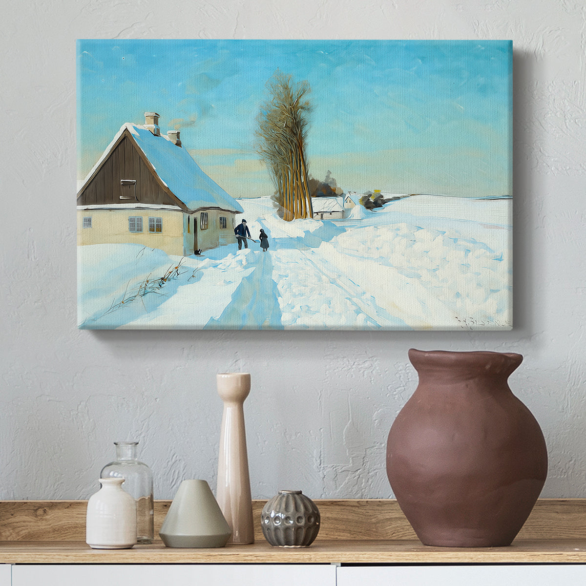 Canvas art print featuring a winter day with fresh snow and figure working outdoors, styled above a decorative console