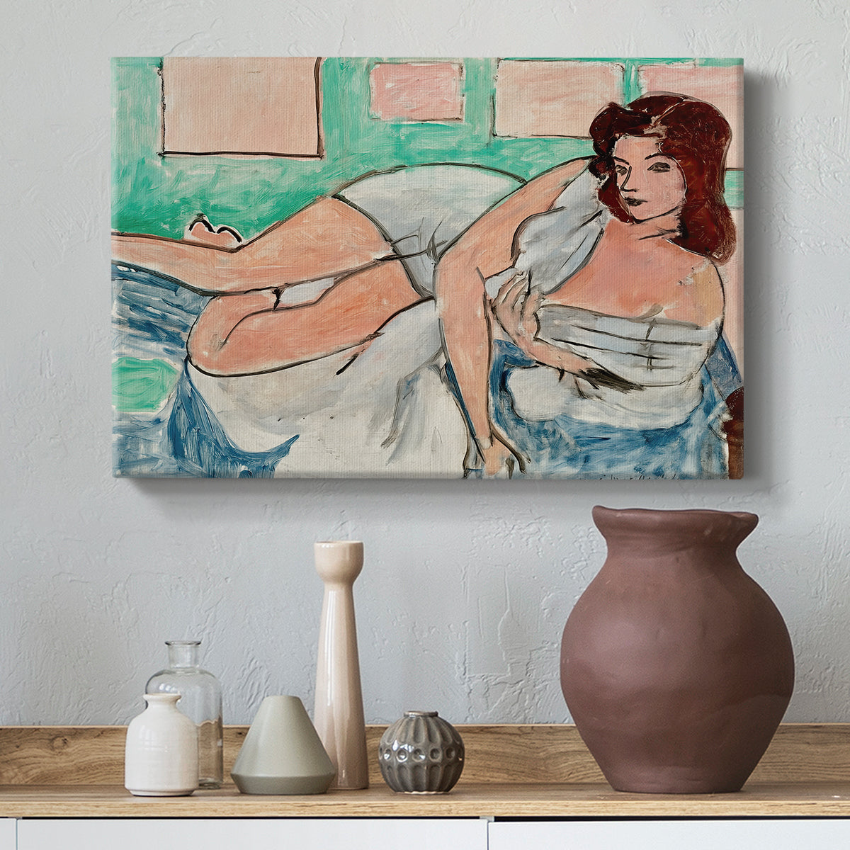 Canvas art print featuring a Fauvist figure study of a woman resting indoors, styled above a decorative console