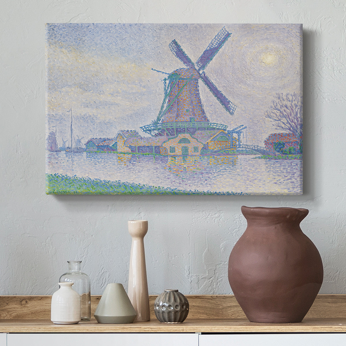 Canvas art print featuring a countryside view with windmill, styled above a decorative console