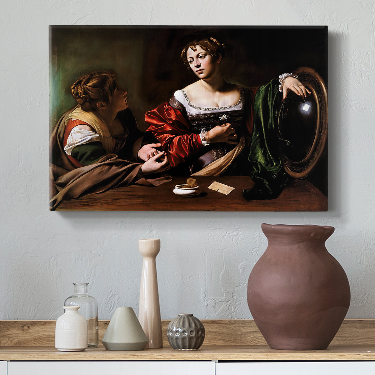 Canvas art print featuring an intimate interaction between two women with mirror and objects, styled above a decorative console