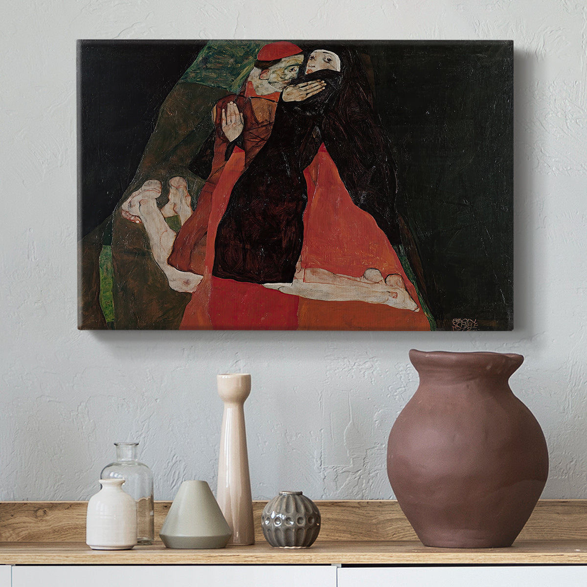 Canvas art print featuring an expressive painting of figures entwined with bold lines and color, styled above a decorative console