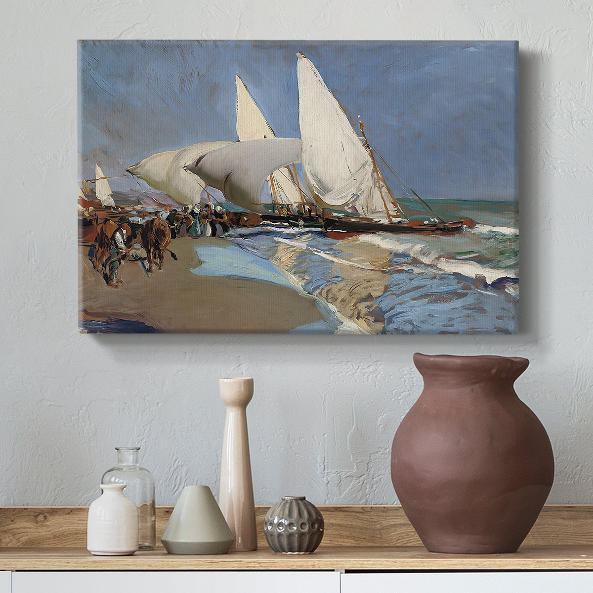 Canvas art print featuring an impressionist beach view with transport and figures, styled above a decorative console