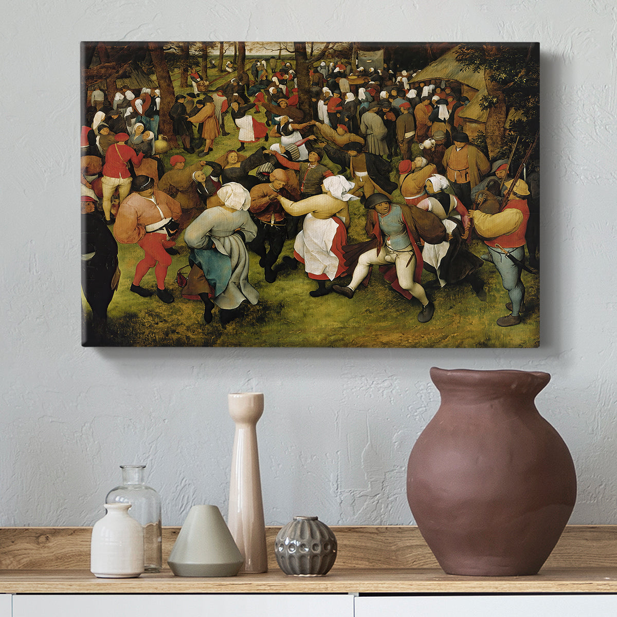 Canvas art print featuring figures interacting in festive setting, styled above a decorative console