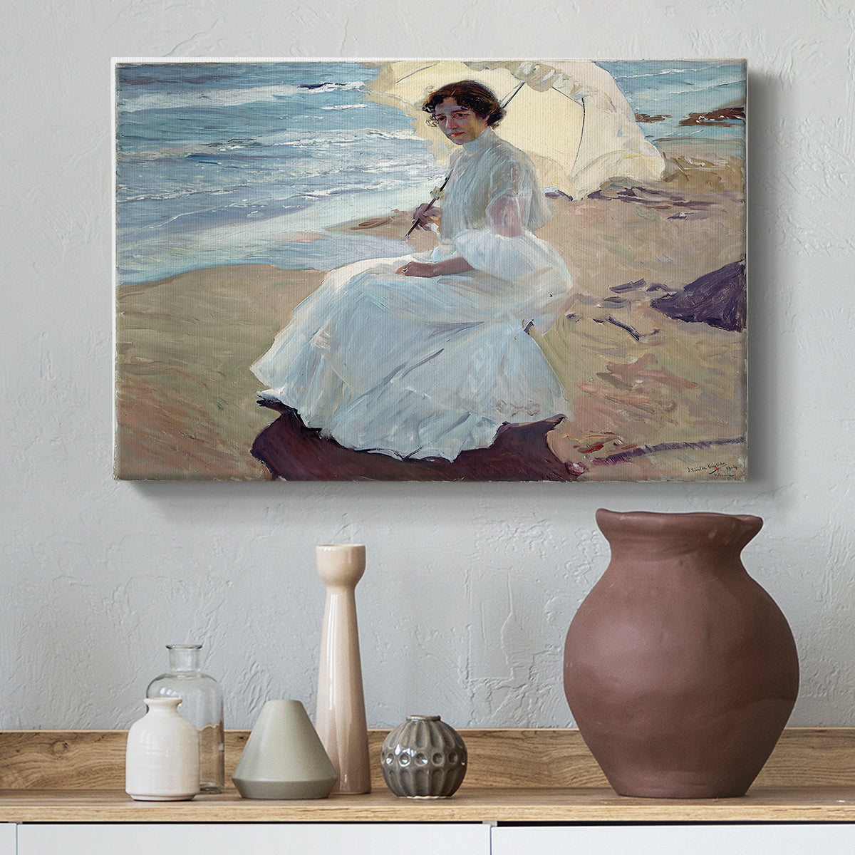 Canvas art print featuring an impressionist figure study with ocean backdrop, styled above a decorative console