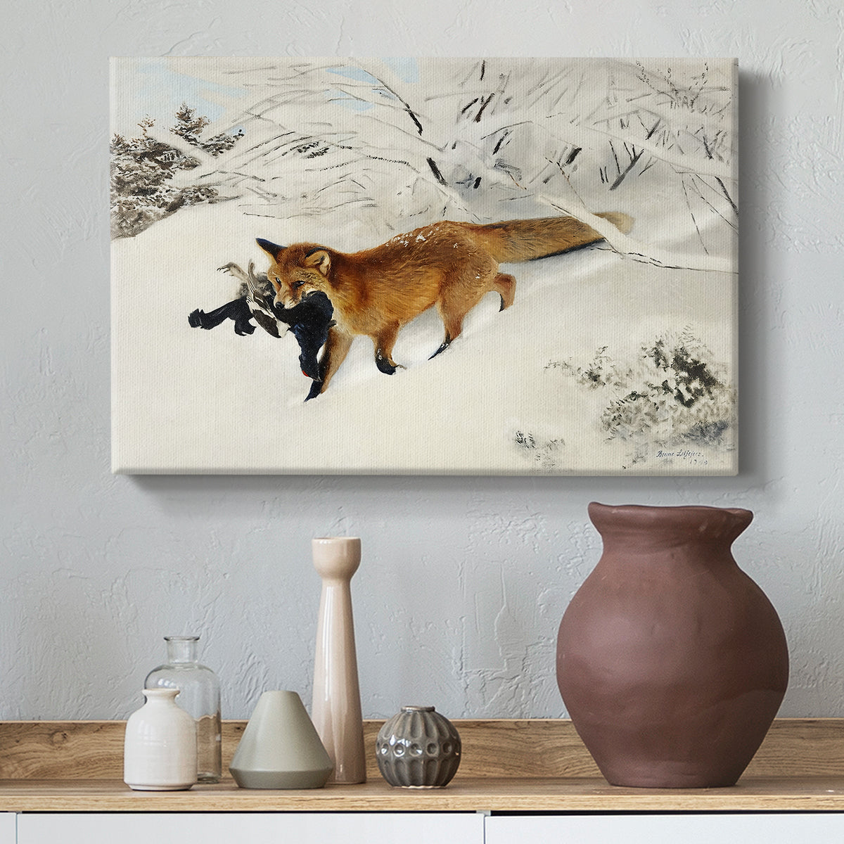 Canvas art print featuring a red fox crossing snow-covered ground under pale sky, styled above a decorative console