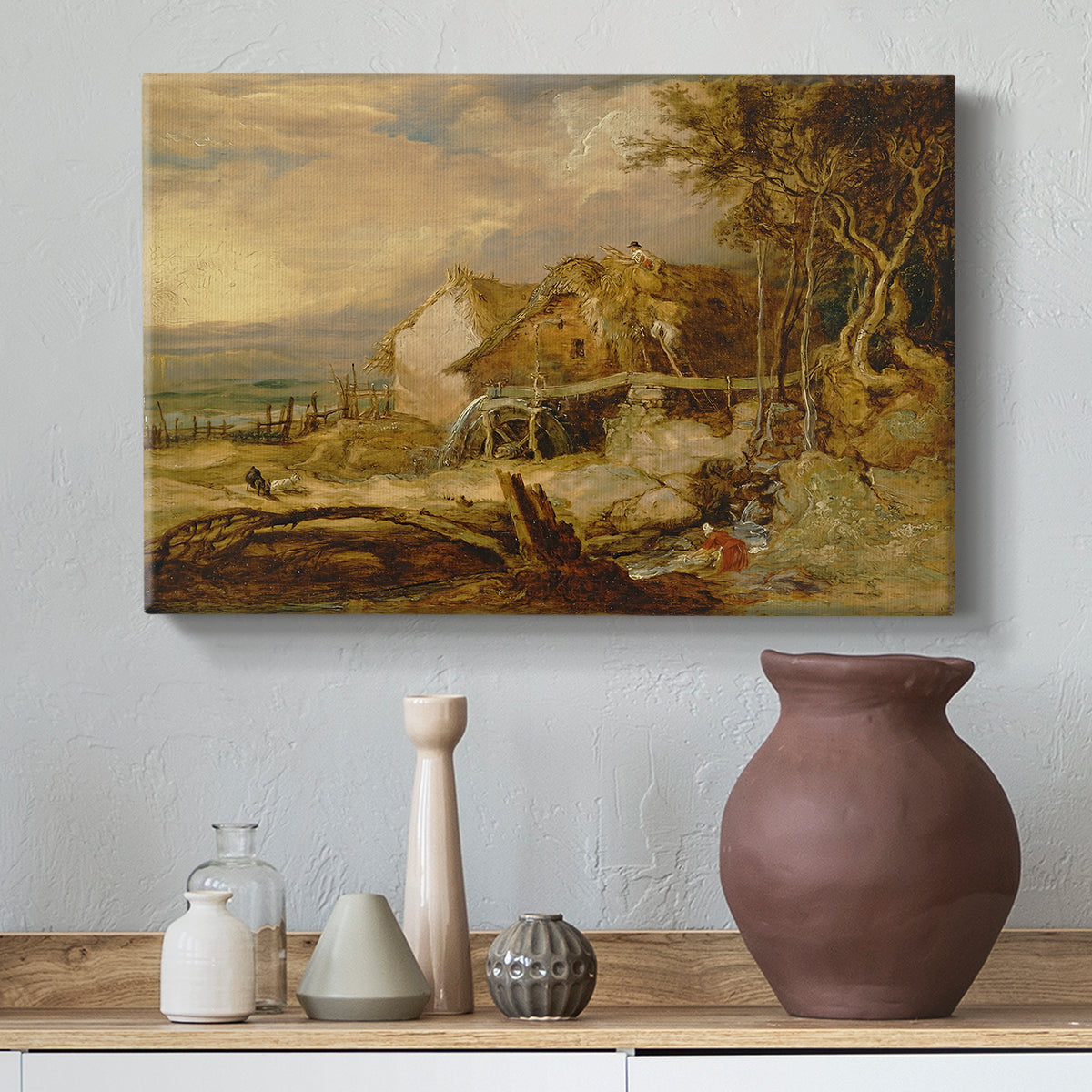 Canvas art print featuring a countryside scene with architecture and moving water, styled above a decorative console